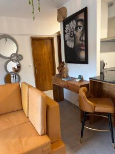 a living room with a couch and a table at Zen escape-ocean view Papeete in Papeete