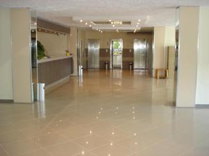 a lobby of a building with a tile floor at Bonita Hotel in Golden Sands