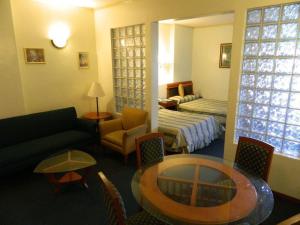 a living room with a couch and a table at DJ Paradise Hotel in Tikay +42 photos