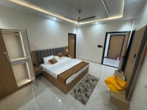a bedroom with a large bed in a room at Hotel Brijraj Dham in Govardhan