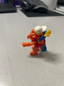 a toy figurine of a person walking on the floor at Hamsiah in Sandakan