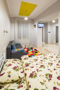 a living room with two beds and a couch at Apartment on Pekarska street зі світлом! in Lviv