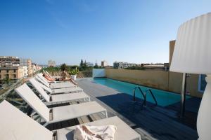 a balcony with a swimming pool on top of a building at Room Of Andrea Hotel in Trapani