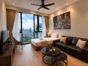 a living room with a couch and a large window at STAR Residence KLCC - Dreamland Holiday Home in Kuala Lumpur