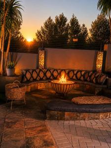a fire pit in the middle of a patio at Jul Rick House Guesthouse in Sandton