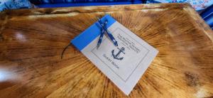 a pair of scissors on a piece of paper on a table at Sometimes Creek Cabins in Seward