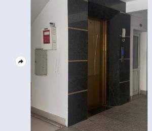 a hallway with a wall with a heater and a door at G7 Hotel in Quyền Hoành +5 photos