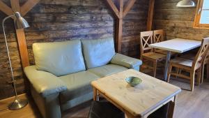 a living room with a couch and a table at Strandbude in Heringsdorf