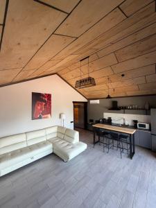 a living room with a couch and a table at СвояХата in Svityazʼ