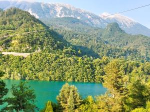 a lake in the middle of a mountain at Bungalow Perun in Blejska Dobrava +1 photo