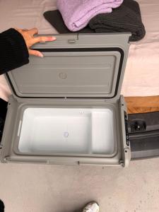 two open drawers with a persons hand inside of it at Caddy Car in Brisbane