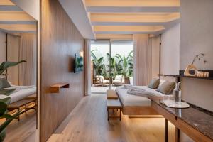 a living room with a couch and a table at The ABY in Tel Aviv