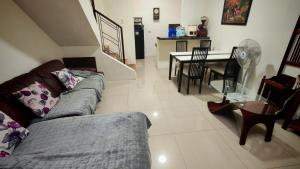 a living room with a couch and a table at Janice Place 2 in Marilao