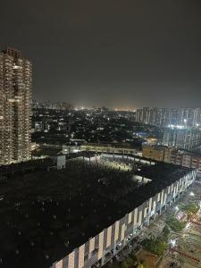 a view of a city at night with buildings at THE MOONLIGHT STUDIo in Ghaziabad +2 photos