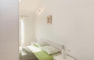 Łóżko lub łóżka w pokoju w obiekcie Villa Kontesici 12