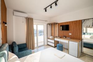 a hotel room with a bed and a desk at Vila Naço Ksamil in Ksamil