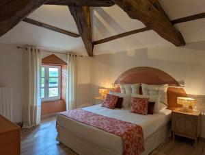 a bedroom with a large bed in a room at Maison d'Hôtes Le Clos de Bacchus in Julienne +45 photos