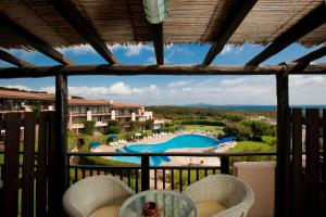 a view from the balcony of a resort at Sporting Hotel in Cannigione +6 photos