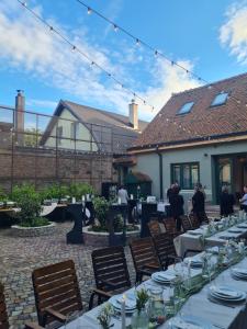 a table set up for a party in a courtyard at Porumbacu134 in Porumbacu de Sus