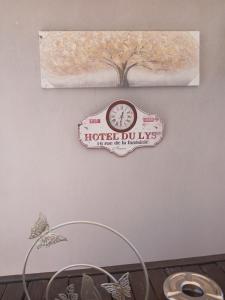 a sign on a wall with a clock on it at Evi's balcony in Karditsa +36 photos