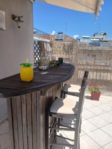 a bar on a balcony with a pineapple on it at Evi's balcony in Karditsa