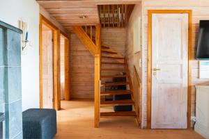 a wooden staircase in a tiny house at Villa Alli in Siikainen