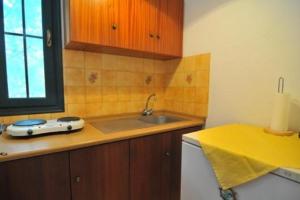 a kitchen with a sink and a counter top at Studios Filippina in Skala Potamias