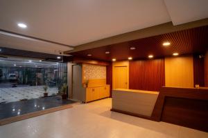 a lobby of a building with a reception desk at Magnet Hotel in Vijayawāda