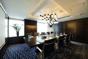 a large dining room with a long table and chairs at Courtyard by Marriott Hong Kong in Hong Kong