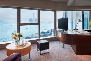 a living room with a view of the ocean at Courtyard by Marriott Hong Kong in Hong Kong