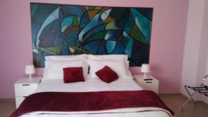 Posteľ alebo postele v izbe v ubytovaní B&b Bagheria