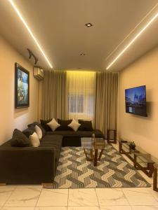 a living room with a couch and a table at Tarek in Oran