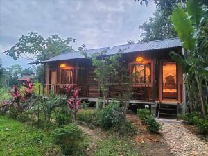 a house in the middle of a field at Nam house - vulinh Homestay&bungalow in Vũ Linh