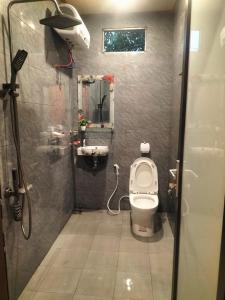 a small bathroom with a toilet and a sink at Nam house - vulinh Homestay&bungalow in Vũ Linh +106 photos