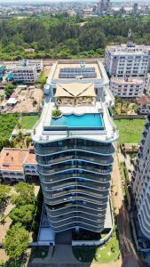 an aerial view of a large building with a swimming pool at Diane Homes Evoque nyali in Mombasa