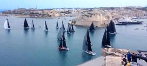 a group of sailboats in a large body of water at Apartment best Harbour view in Valletta