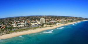 an aerial view of a beach and the ocean at Scarborough Beach Shack in Perth