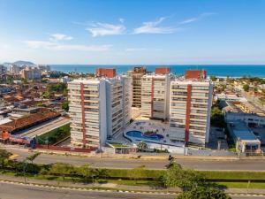 an aerial view of a city with the ocean at San Martin in Bertioga