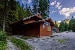 a small building on the side of a road at Apartmán Milka in Demanovska Dolina +4 photos