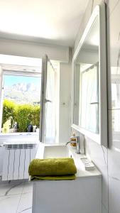 a white kitchen with a sink and a window at Villa Amore in Oltre il Colle +87 photos