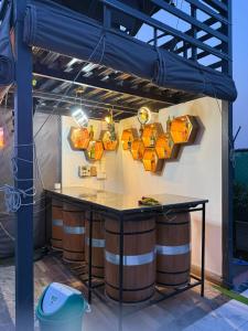 a tasting room with orange lights on the wall at Oliv Faram house in Greater Noida +1 photo