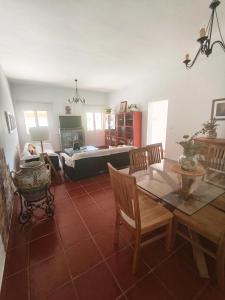 a living room with a table and a couch at Chalet Matalascañas in Matalascañas