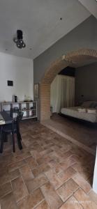 a large room with a bed and a table at A Casa di Dody in Guidonia +23 photos