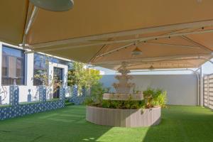 a pavilion with a wedding cake under a tent at Villa Berka in Barka