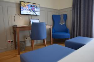 TV a/nebo společenská místnost v ubytování Charming Blue
