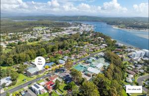 an aerial view of a town next to the water at The Olive Edit in Batemans Bay