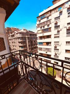 a balcony with a view of some buildings at Sama Hotel Sherif Basha in Cairo