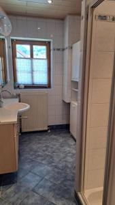 a small kitchen with a sink and a refrigerator at Ferienvilla Schwarzenbach in Schwarzenbach an der Gölsen