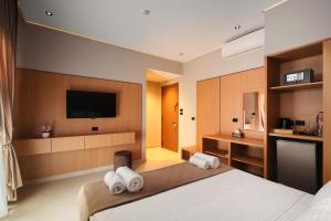 a hotel room with a bed and a flat screen tv at Royal Hotel in Cairo +42 photos