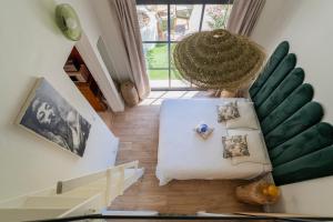 an overhead view of a living room with a couch at L'hôtel des oiseaux in Les Baux-de-Provence